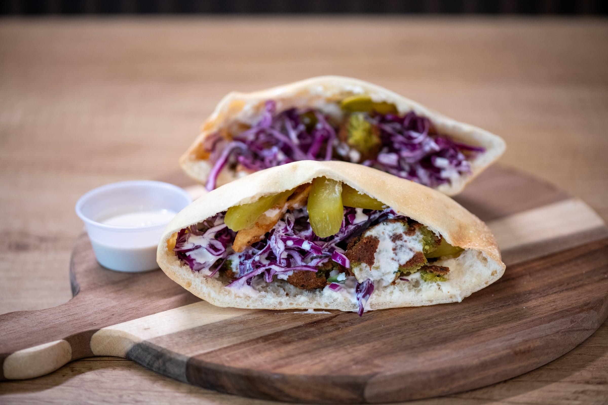 Fresh pita filled with falafel and vegetables